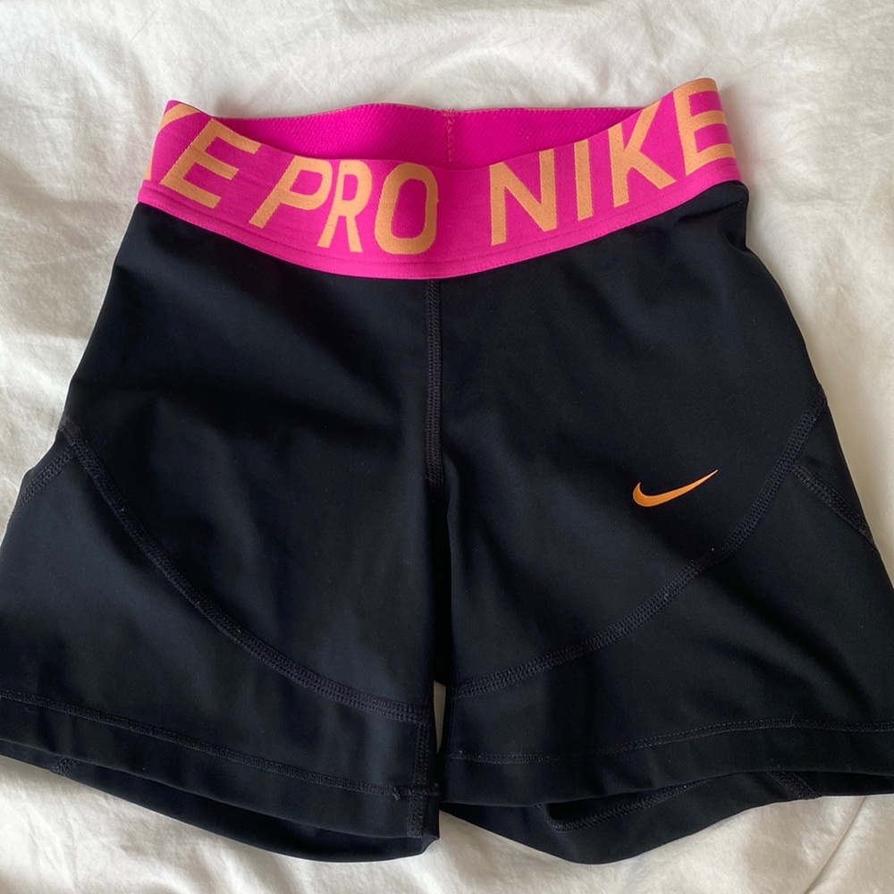 XS Nike pros, pink and orange waistband